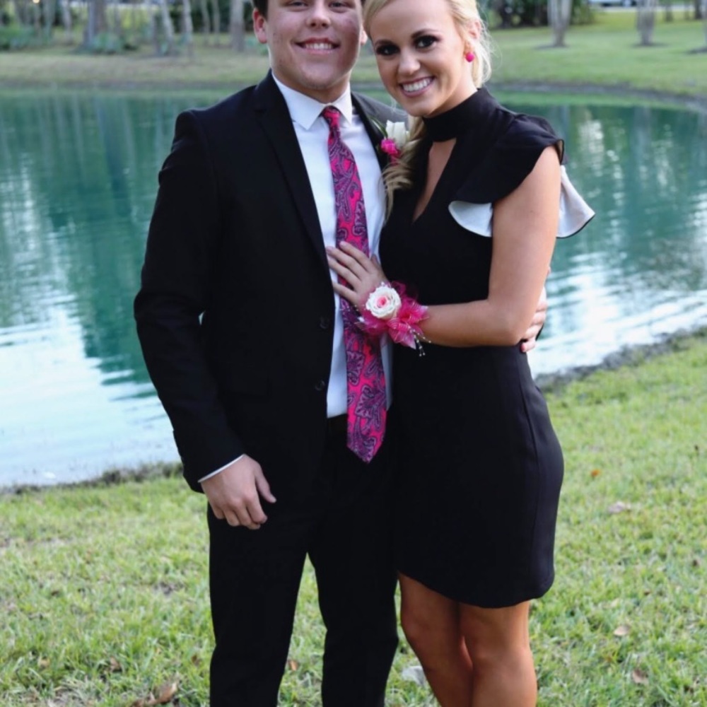 Black dress open back with one ruffle on shoulder